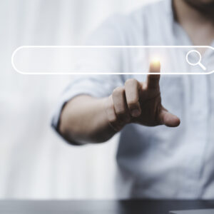 hand touching with search icon for search engine optimisation or